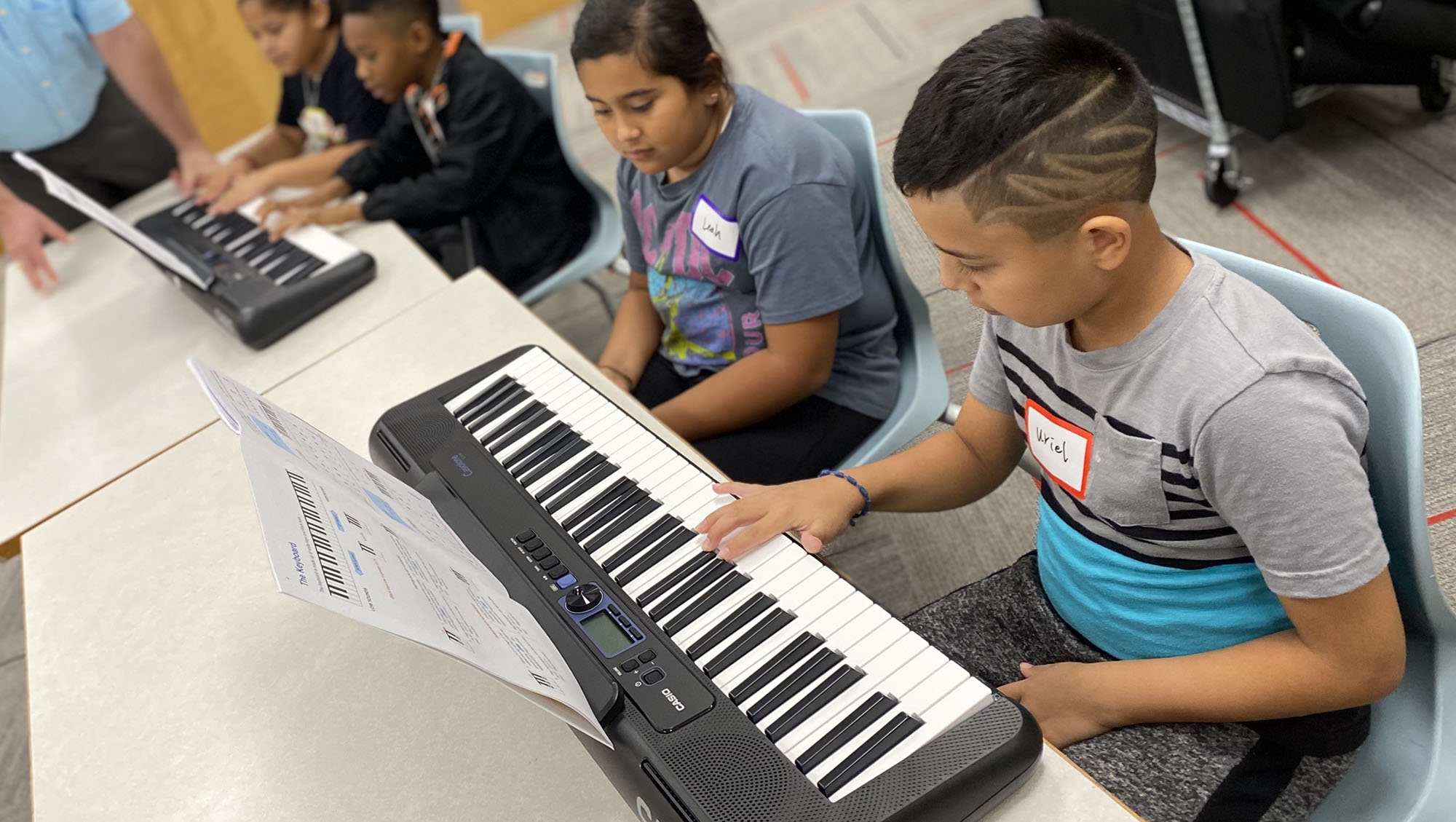 Kids playing keyboards